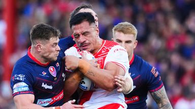 Picture by Olly Hassell/SWpix.com - 04/10/2025 - Rugby League - Betfred Super League Semi-final - Hull KR v St Helens - Sewell Group Craven Park, Hull, England - Sauaso Sue of Hull KR is tackled by Morgan Knowles of St Helens