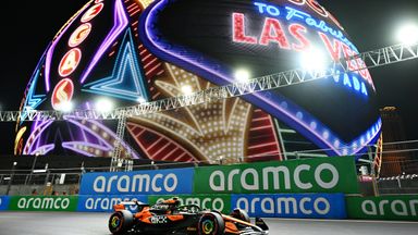 Lando Norris on track passing Las Vegas' immersive Sphere venue in 2024