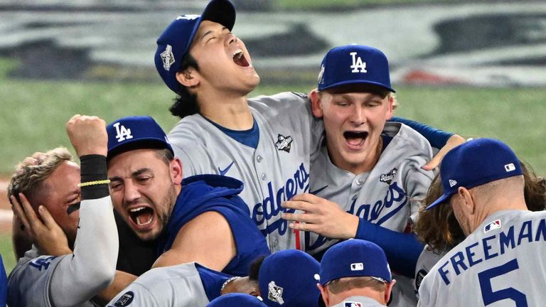Shohei Ohtani (back center) and his team-mates celebrate the Dodgers' victory