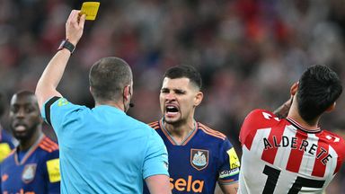 Bruno Guimaraes reacts as referee Peter Bankes shows him a yellow card against Sunderland