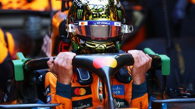 Lando Norris settles back into his title-winning McLaren with a special crash helmet for the occasion