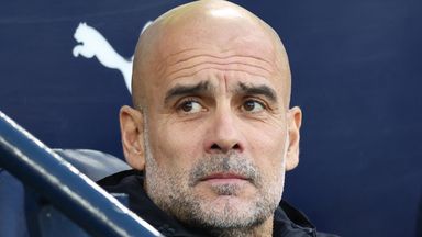 Pep Guardiola looks on ahead of Man City's Premier League game against West Ham
