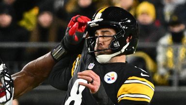 Pittsburgh Steelers quarterback Aaron Rodgers (8) loses possession of the ball while being tackled by Houston Texans defensive end Danielle Hunter (55) during the second half of an NFL wild-card playoff football game, Monday, Jan. 12, 2026, in Pittsb
