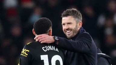 Michael Carrick and Matheus Cunha celebrate after a 3-2 win against Arsenal for Man Utd