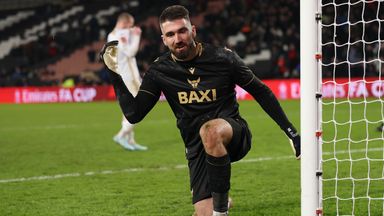 Oxford goalkeeper Matt Ingram celebrates saving MK Dons' fifth penalty
