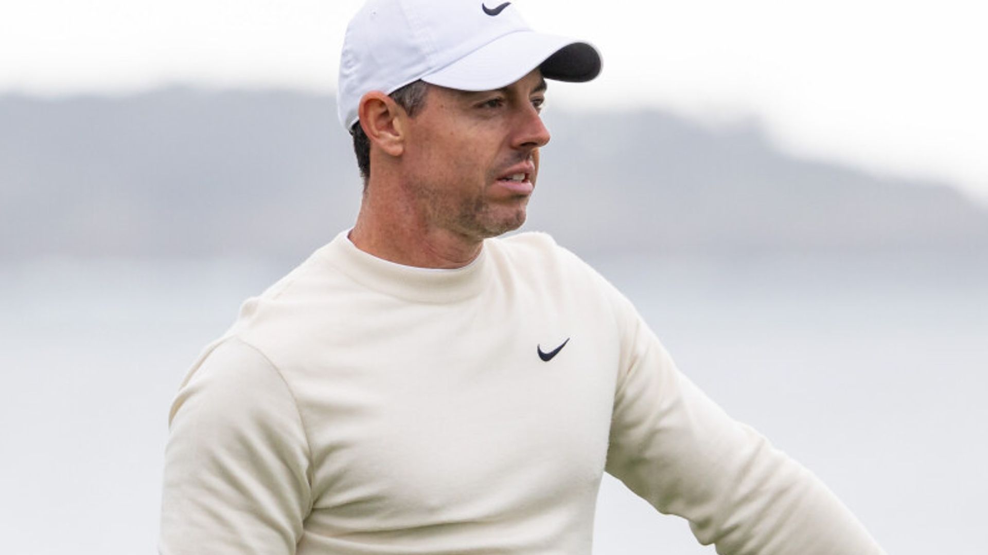 McIlroy six off leaders at Pebble Beach but sees weather hope