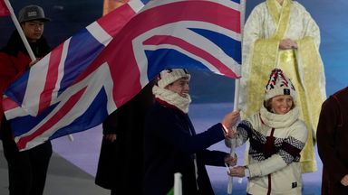Britain's Charlotte Bankes and Matt Weston wave the British flag during the closing ceremony of the 2026 Winter Olympics, in Verona, Italy, Sunday, Feb. 22, 2026. (AP Photo/Ashley Landis)