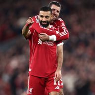 Mohamed Salah is hugged by Dominik Szoboszlai after scoring Liverpool's fourth goal against Galatasaray