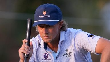 Austin Smotherman lines up a shot on the seventh green during the first round of The Players Championship golf tournament Thursday, March 12, 2026, in Ponte Bedra Beach, Fla. (AP Photo/Gerald Herbert)