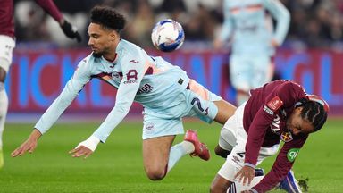 Kevin Schade is tackled by Kyle Walker-Peters