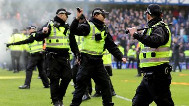 Police officers force fans back at Ibrox