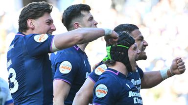 Scotland players celebrate after Darcy Graham scores his second try to extend his team's lead against France