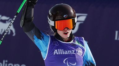 Russia's Varvara Voronchikhina celebrates victory in the vision-impaired Super G at the 2026 Paralympics