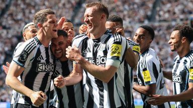 Dan Burn celebrates with his team-mates after scoring Newcastle's second goal against Brighton