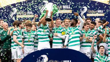 Celtic players celebrate after lifting the Scottish Premiership trophy