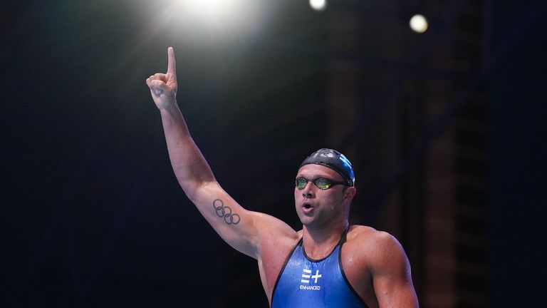 Cody Miller, of the United States, celebrates after winning the men's 100m breaststroke final