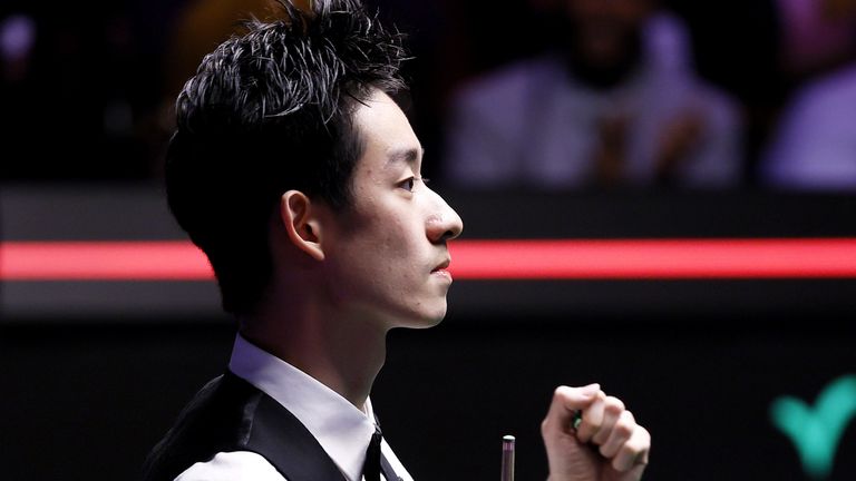 Wu Yize celebrates as his break of 85 in the final-frame decider clinches the 2026 World Snooker Championship title