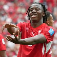 Johan Manzambi celebrates Switzerland's second goal which handed them victory over Canada
