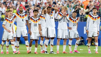 Germany players react after being knocked out of the World Cup by Paraguay