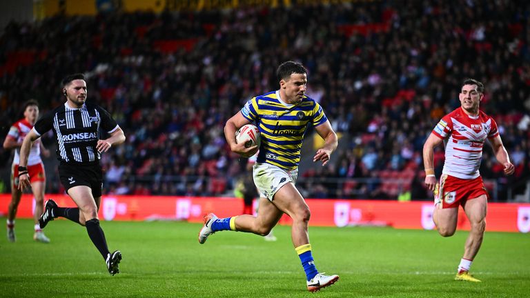 Josh Smith of Warrington makes a break to score a try