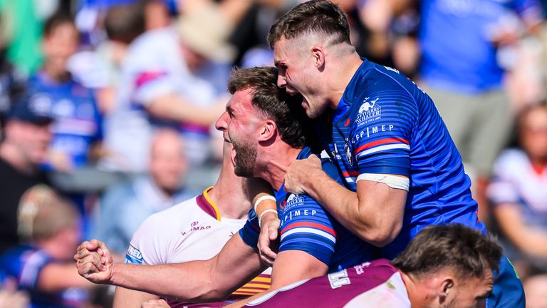 Wakefield's Josh Rourke celebrates scoring the game-winning try as time expires against Huddersfield