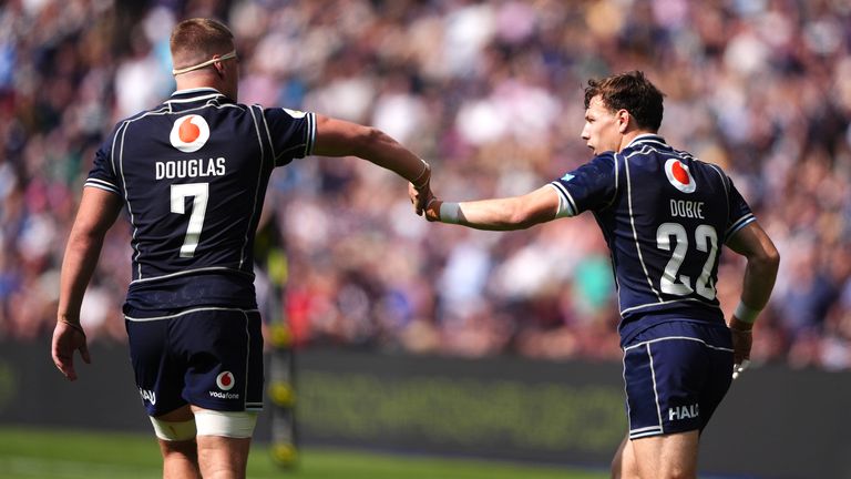 Scotland's Jamie Dobie celebrates his try after coming off the bench