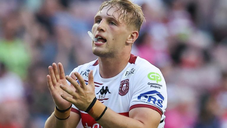 Wigan Warriors' Josh Cartwright celebrates scoring his side's first try against Warrington