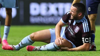 John McGinn of Aston Villa goes down with an injury during the pre-season friendly match between Aston Villa and Pathum United