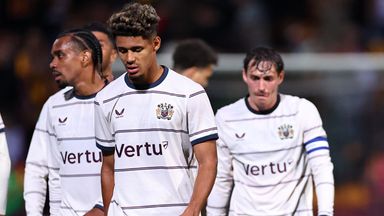 Burnley players look dejected after exiting the Carabao Cup