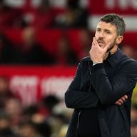 Michael Carrick looks on glumly as his Manchester United side were beaten by Brighton