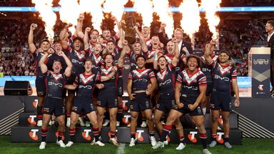 James Tedesco of the Sydney Roosters holds aloft the Provan-Summons Trophy