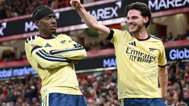 Noni Madueke celebrates with Declan Rice after scoring for Arsenal at the City Ground