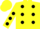 Yellow body, black spots, yellow arms, black spots, yellow cap