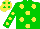 Green body, yellow spots, green arms, yellow spots, yellow cap, green spots